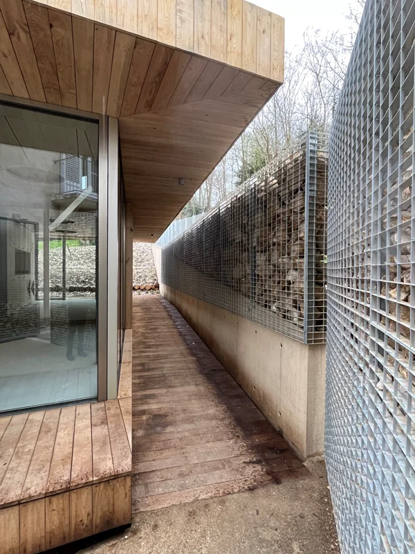 Grating fence used as a gabion kit to prevent any overlooking