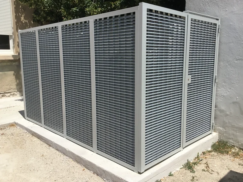 Technical enclosure screened from view thanks to louvered press locked grating while still allowing air circulation