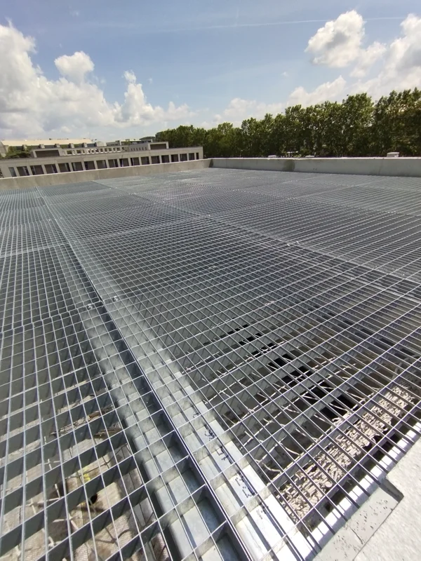 Press locked rooftop grating ensuring efficient rainwater drainage and preventing water accumulation