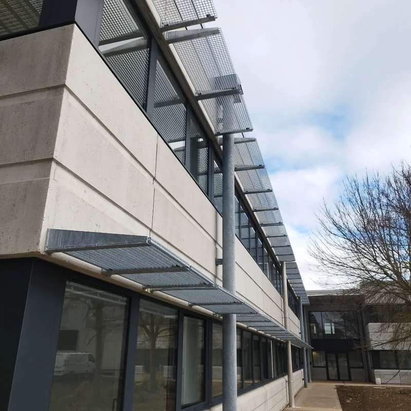 Standard grating panels used as sun breakers for office buildings
