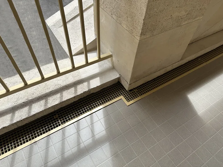 metal grating used as a drainage channel cover to allow water to drain away