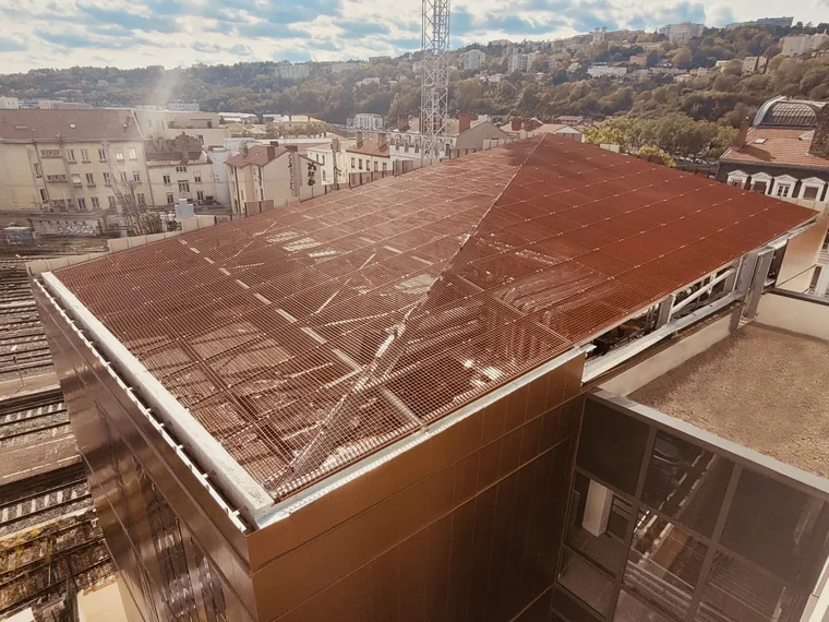 powder-coated metal grating on the rooftop of a building