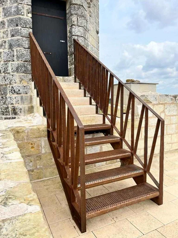 Reconstruction of stair treads in Corten steel for this tower.